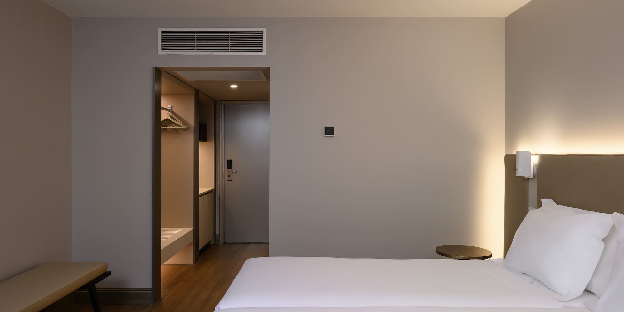 a room with a bed and a door