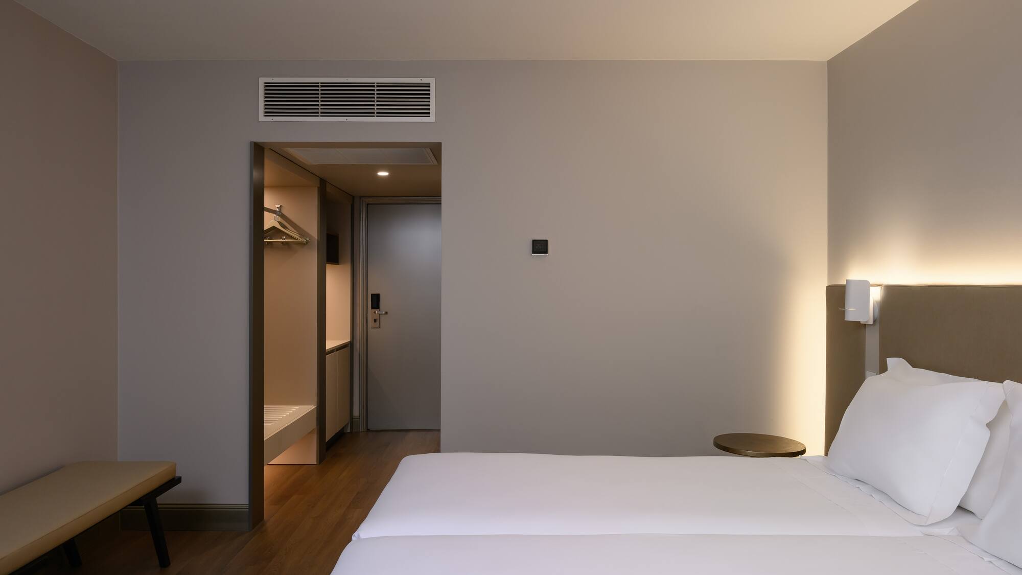 a room with a bed and a door