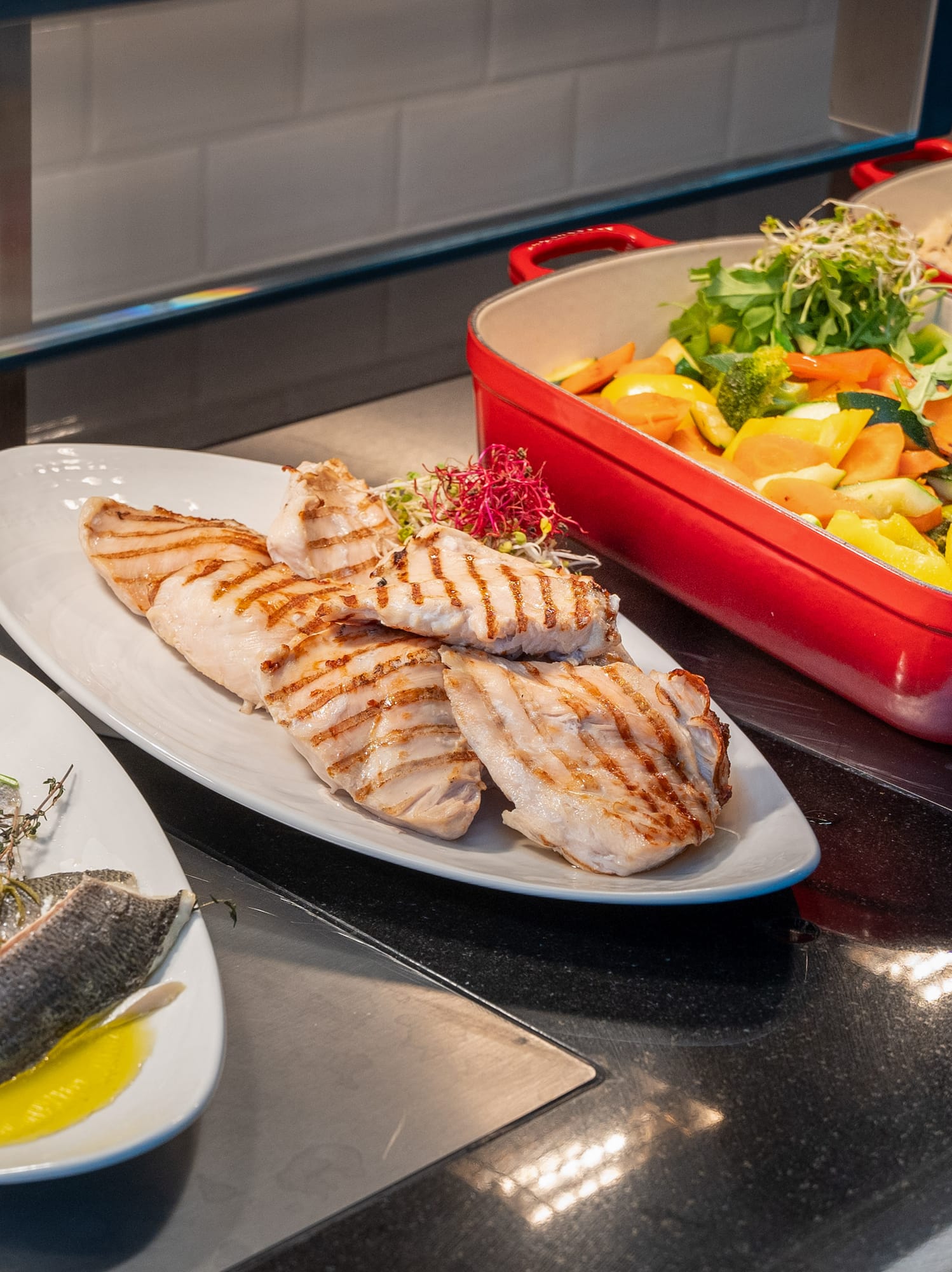 a group of plates of food on a counter