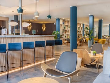 a room with chairs and tables