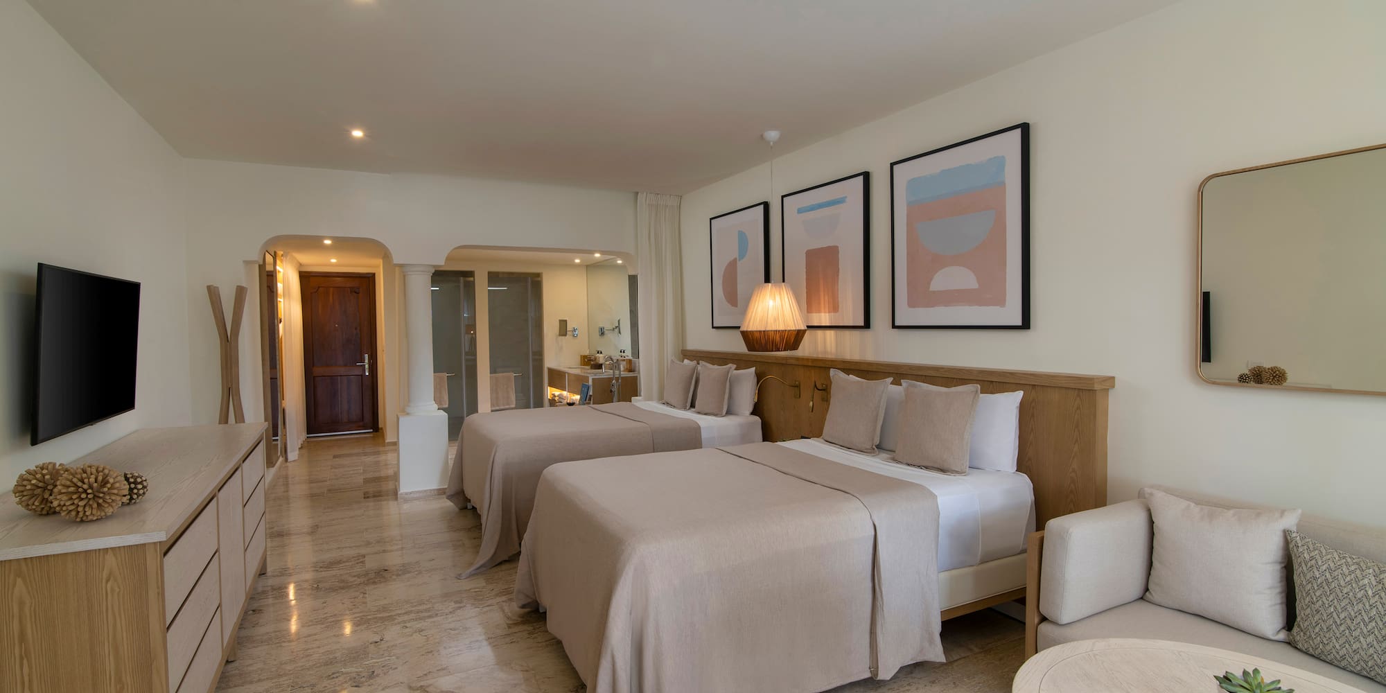 a room with two beds and a table