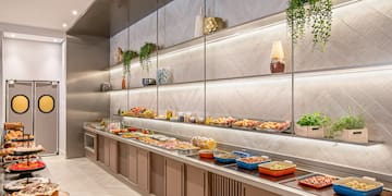 a buffet with food on the shelves