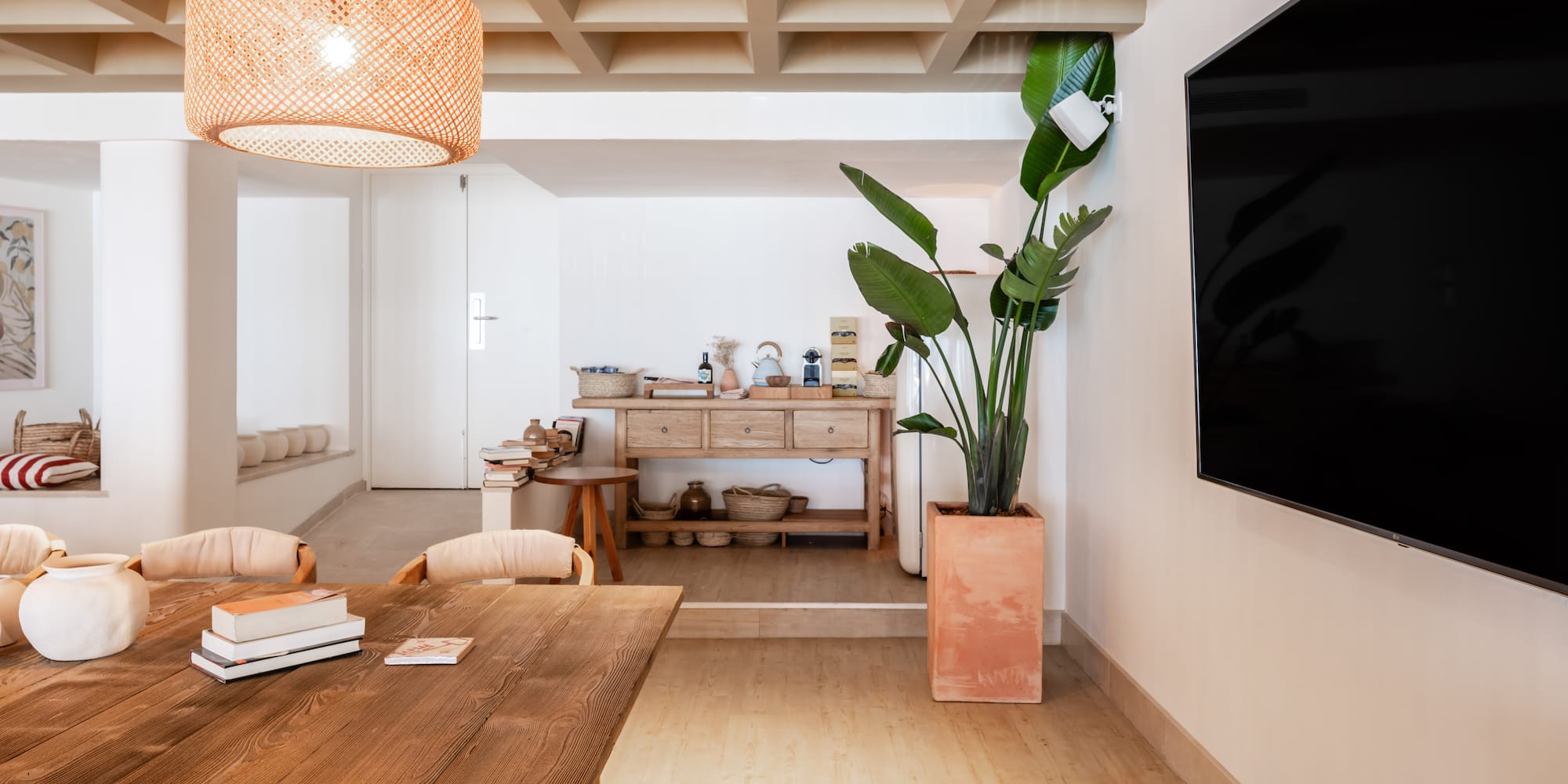 a room with a table and a tv