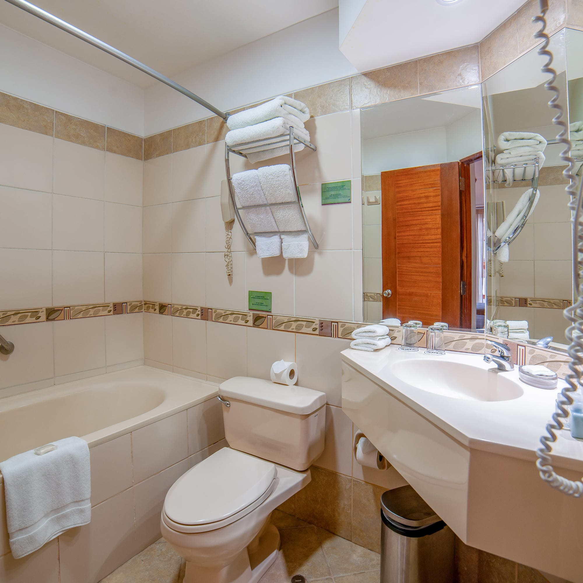 a bathroom with a tub and toilet