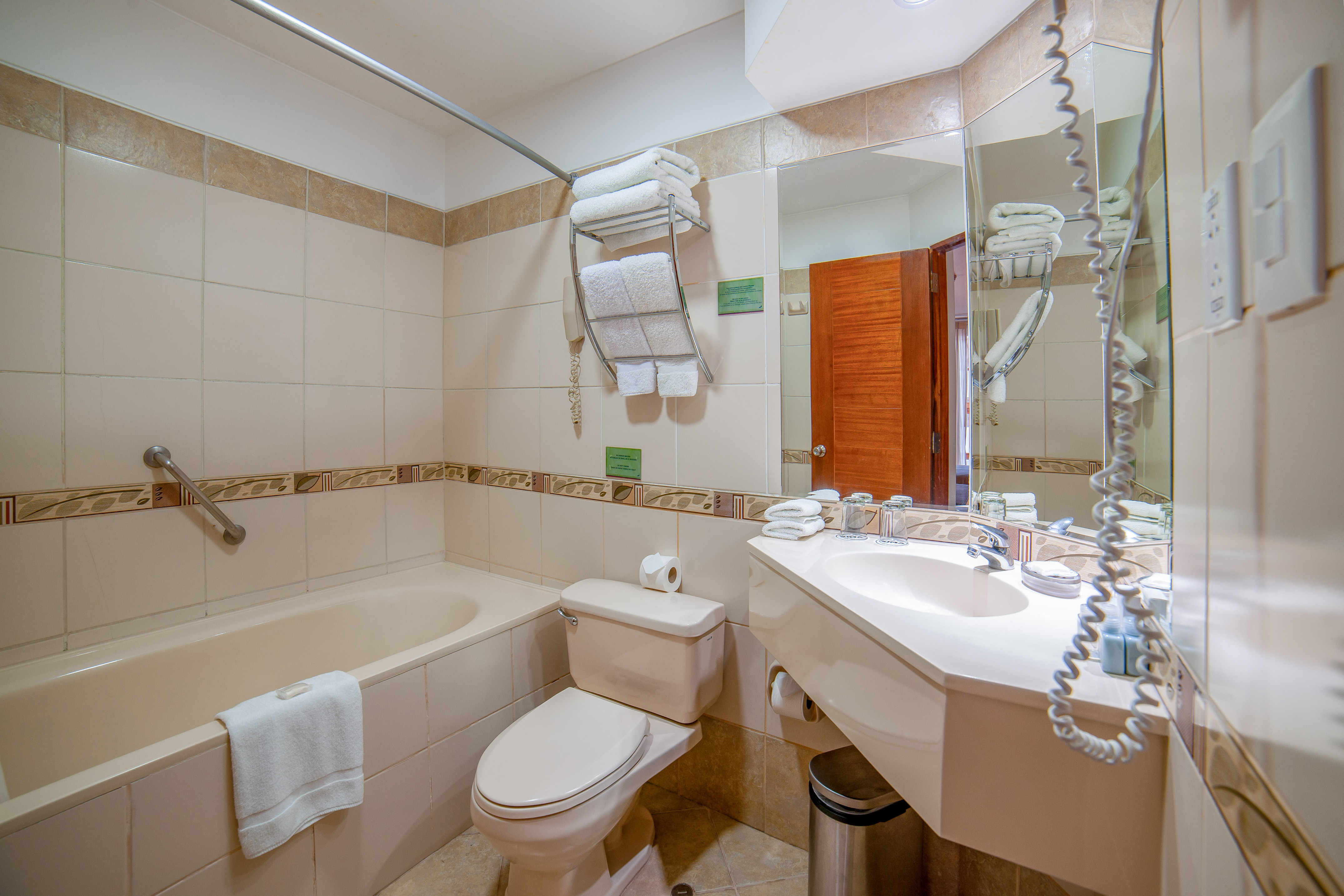 a bathroom with a tub and toilet