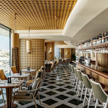 a restaurant with tables and chairs