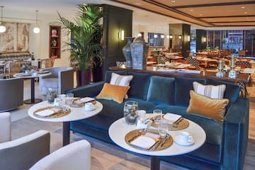 a room with a couch and tables