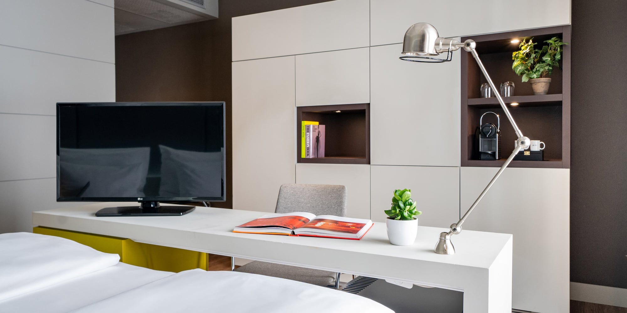 a room with a tv and a book