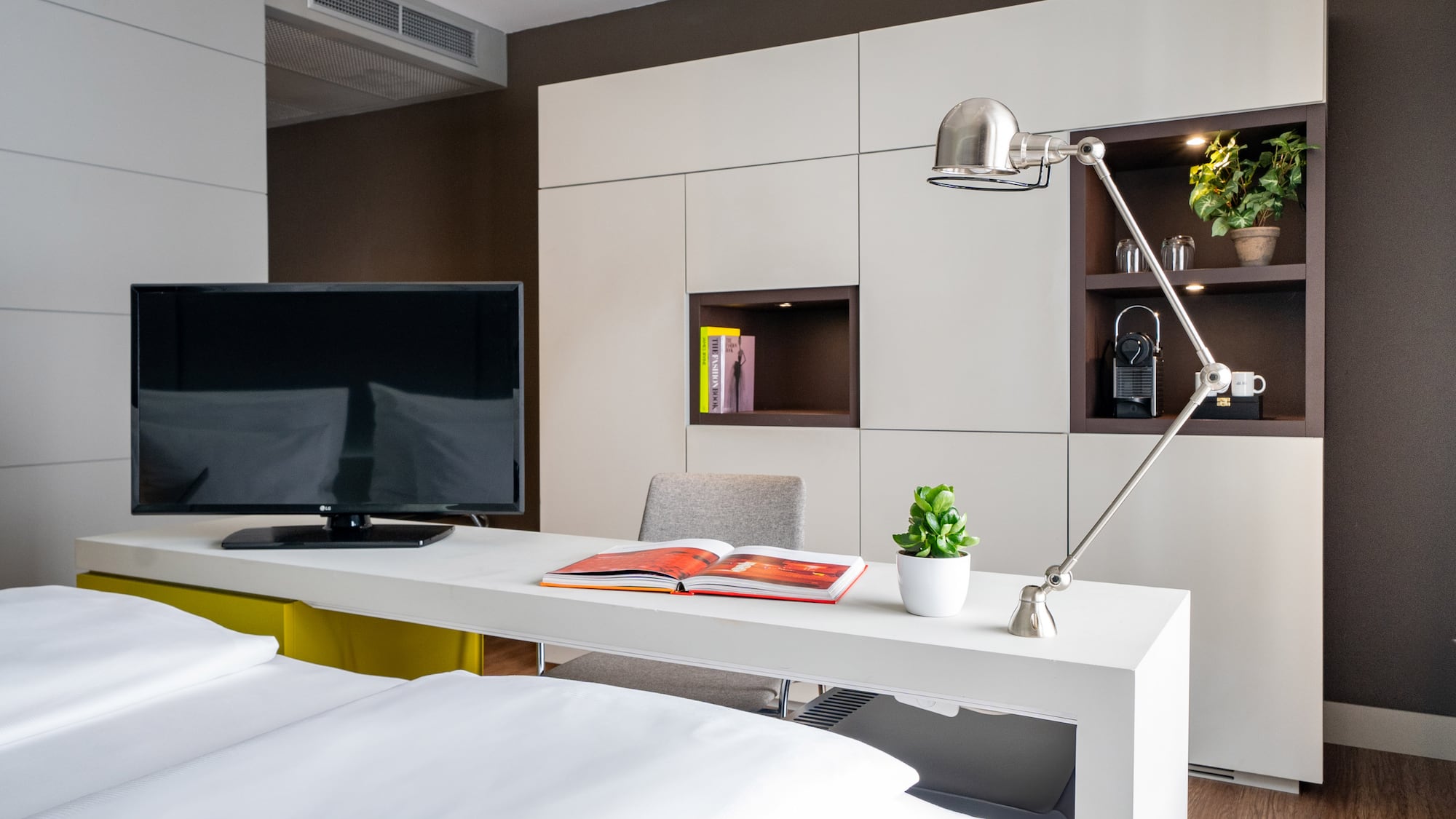 a room with a tv and a book