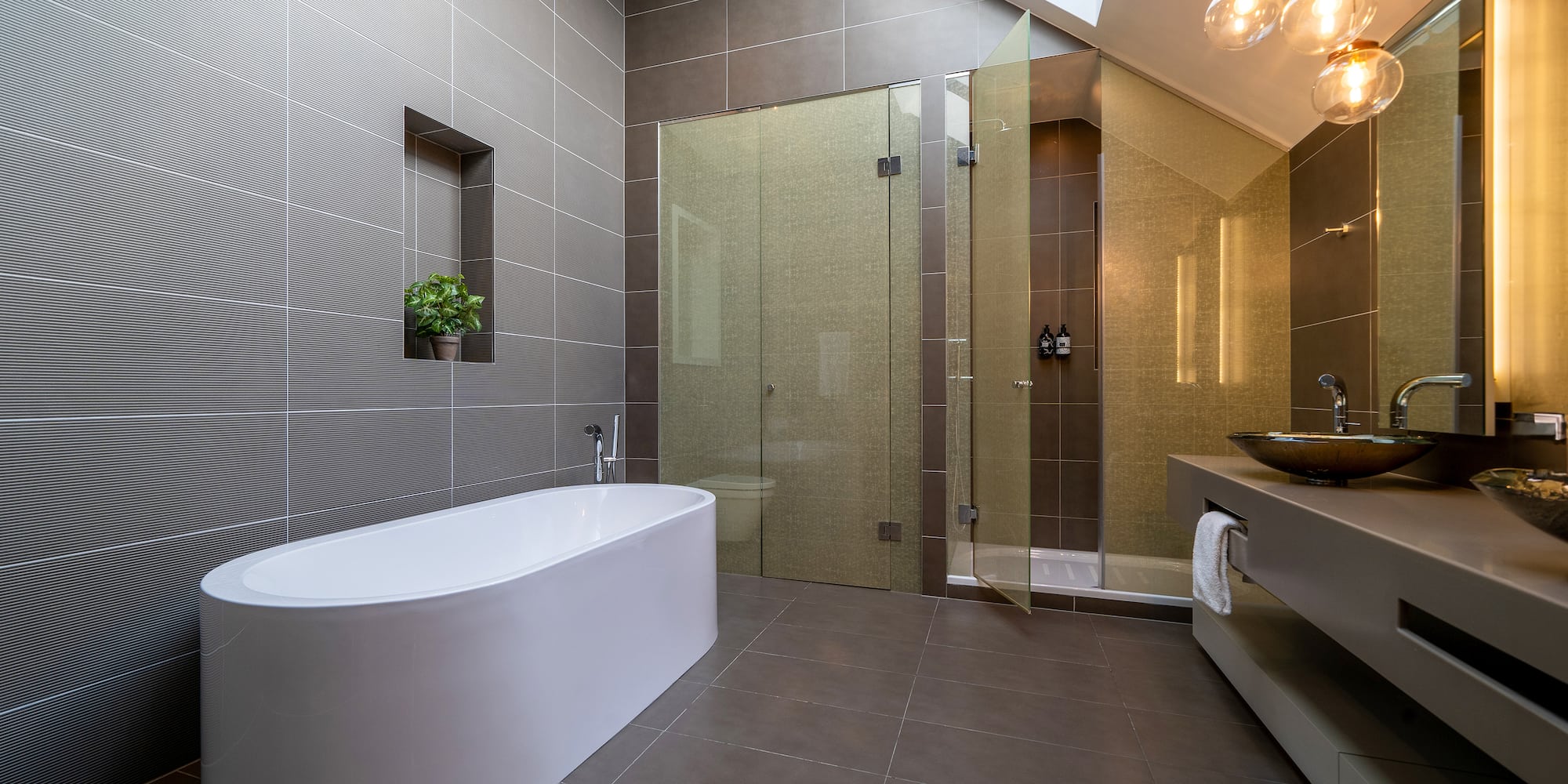 a bathroom with a tub and shower