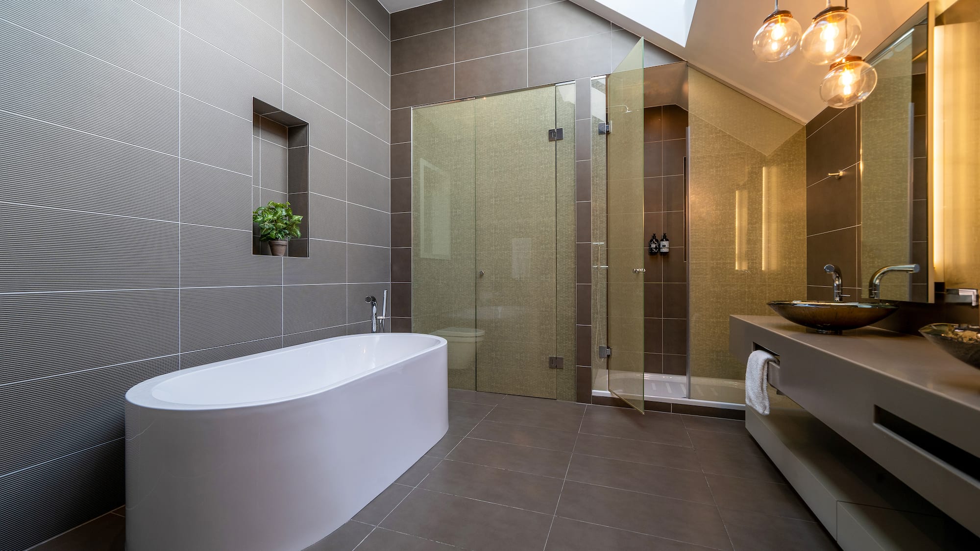 a bathroom with a tub and shower