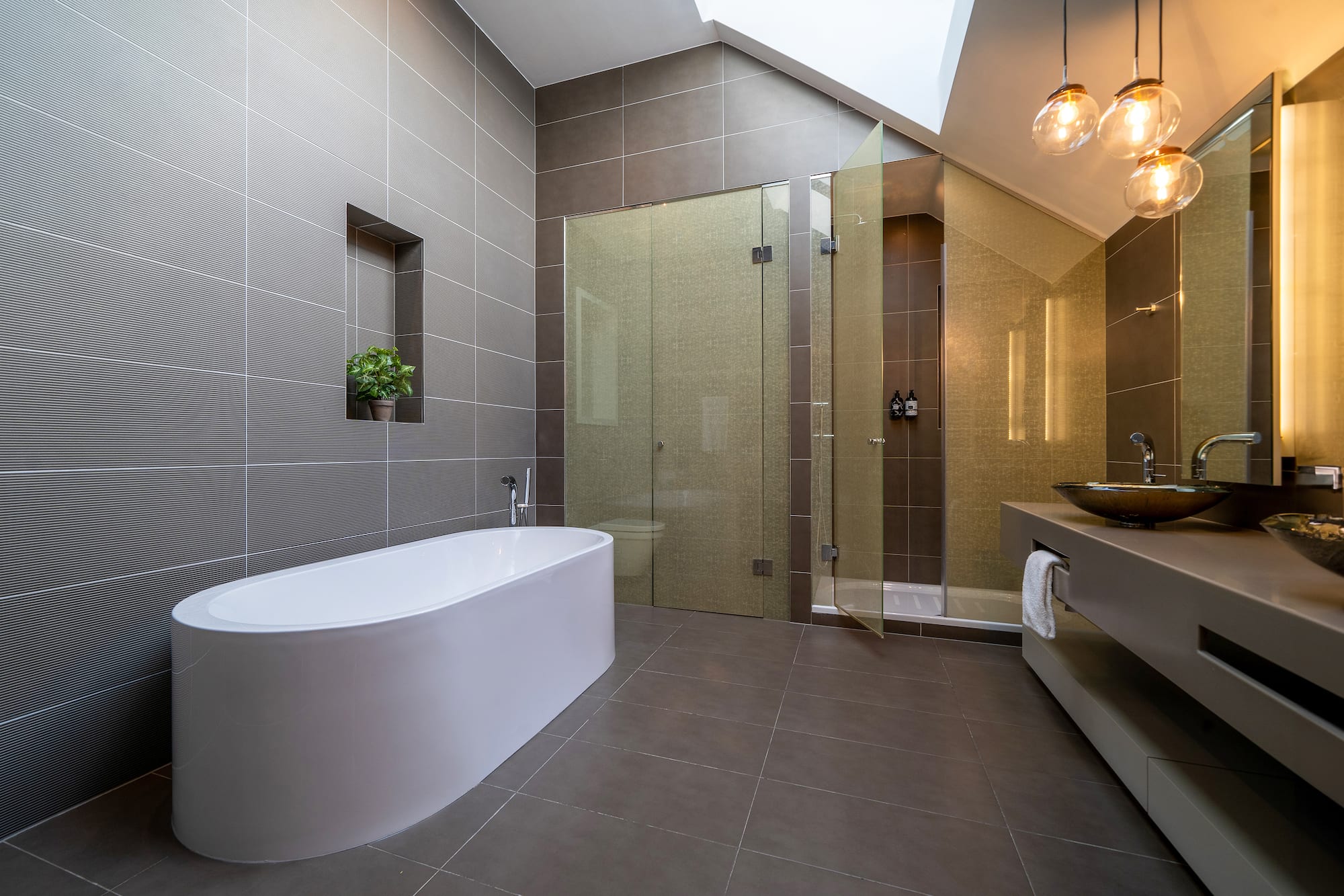 a bathroom with a tub and shower