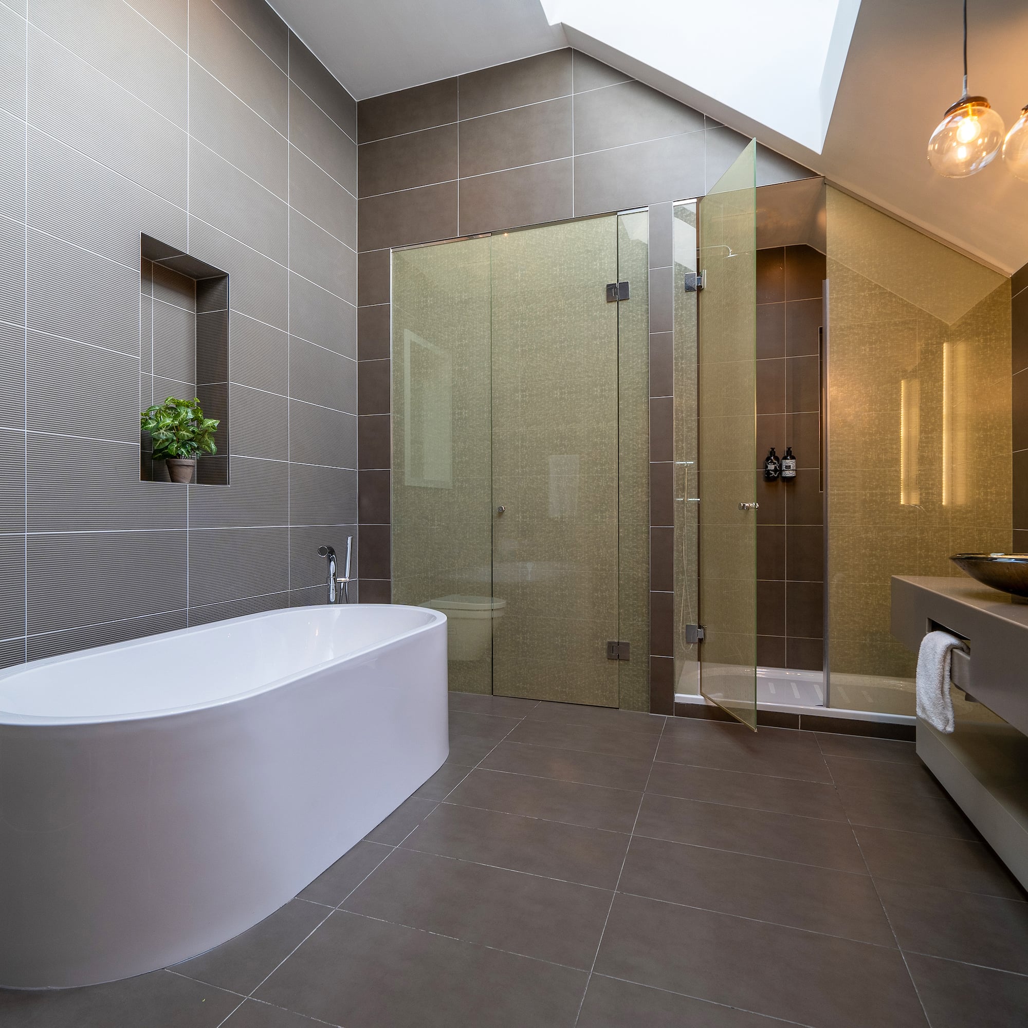 a bathroom with a tub and shower