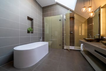 a bathroom with a tub and shower