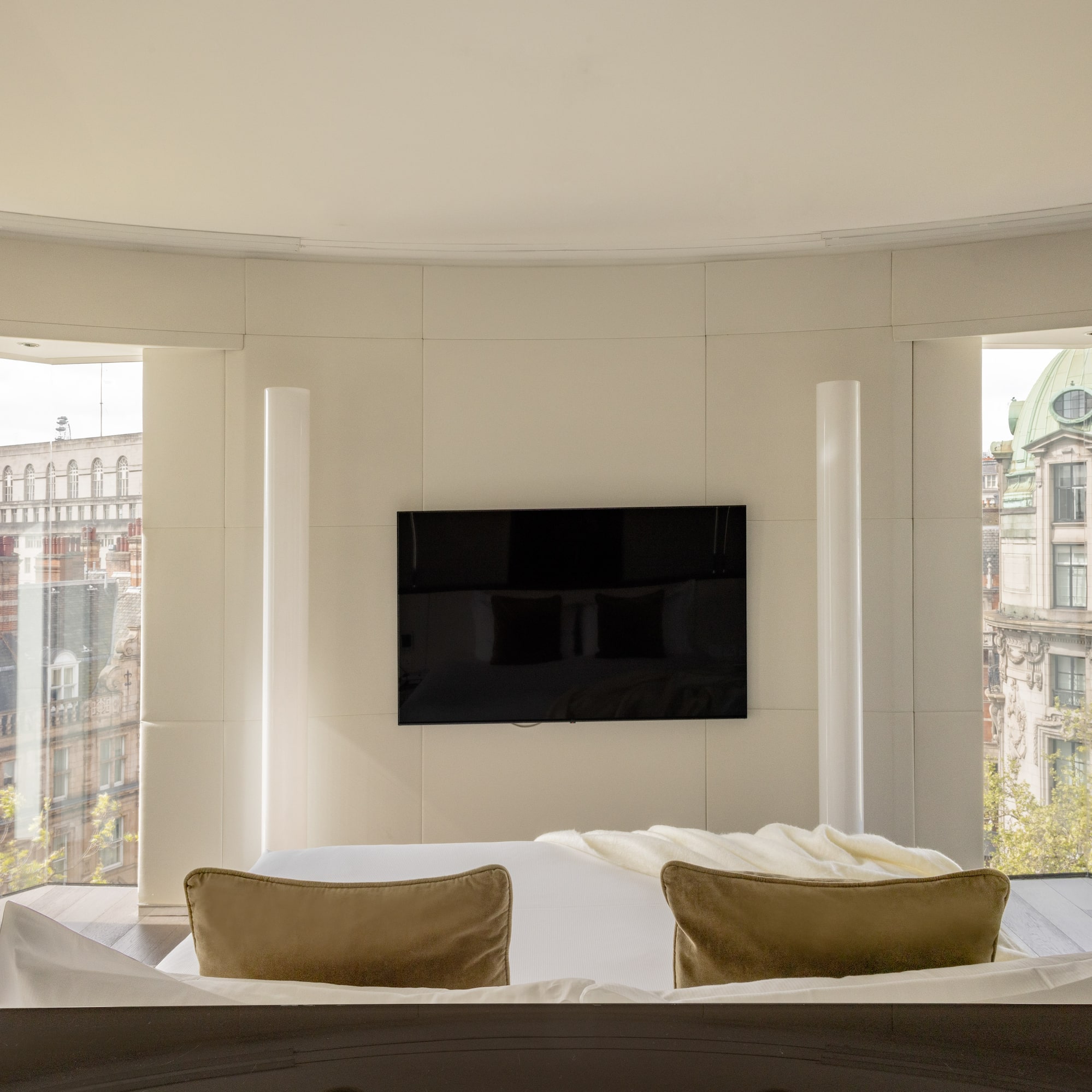 a room with a television on the wall