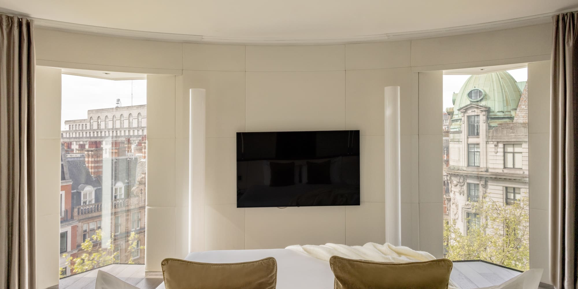 a room with a television on the wall