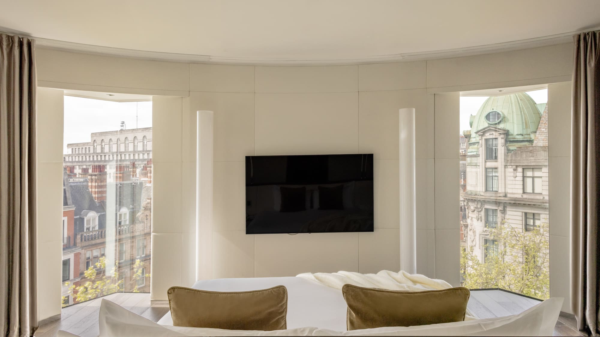 a room with a television on the wall