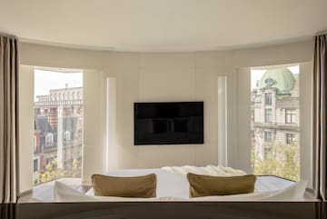 a room with a television on the wall