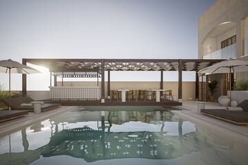 a pool with a deck and a table