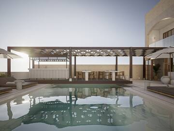 a pool with a deck and a table