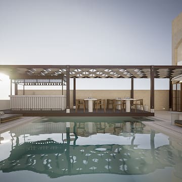 a pool with a deck and a table