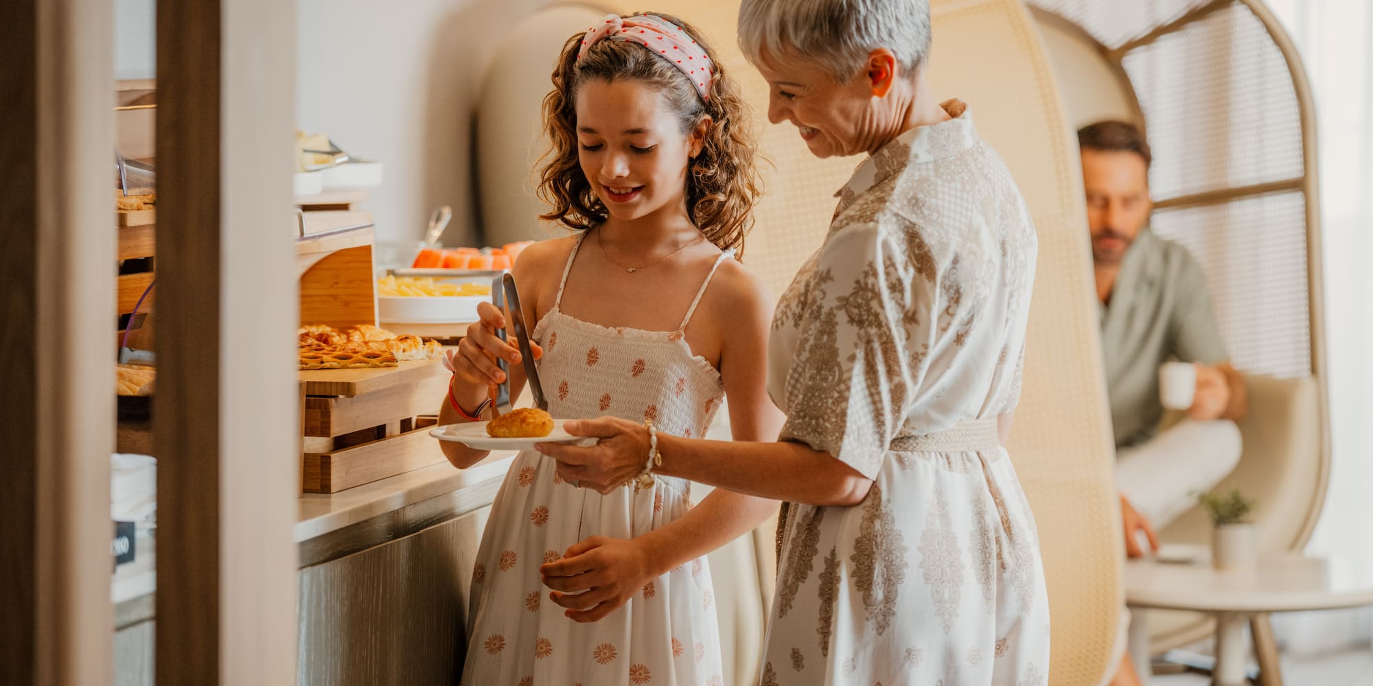 a living room with white couches and a coffee table