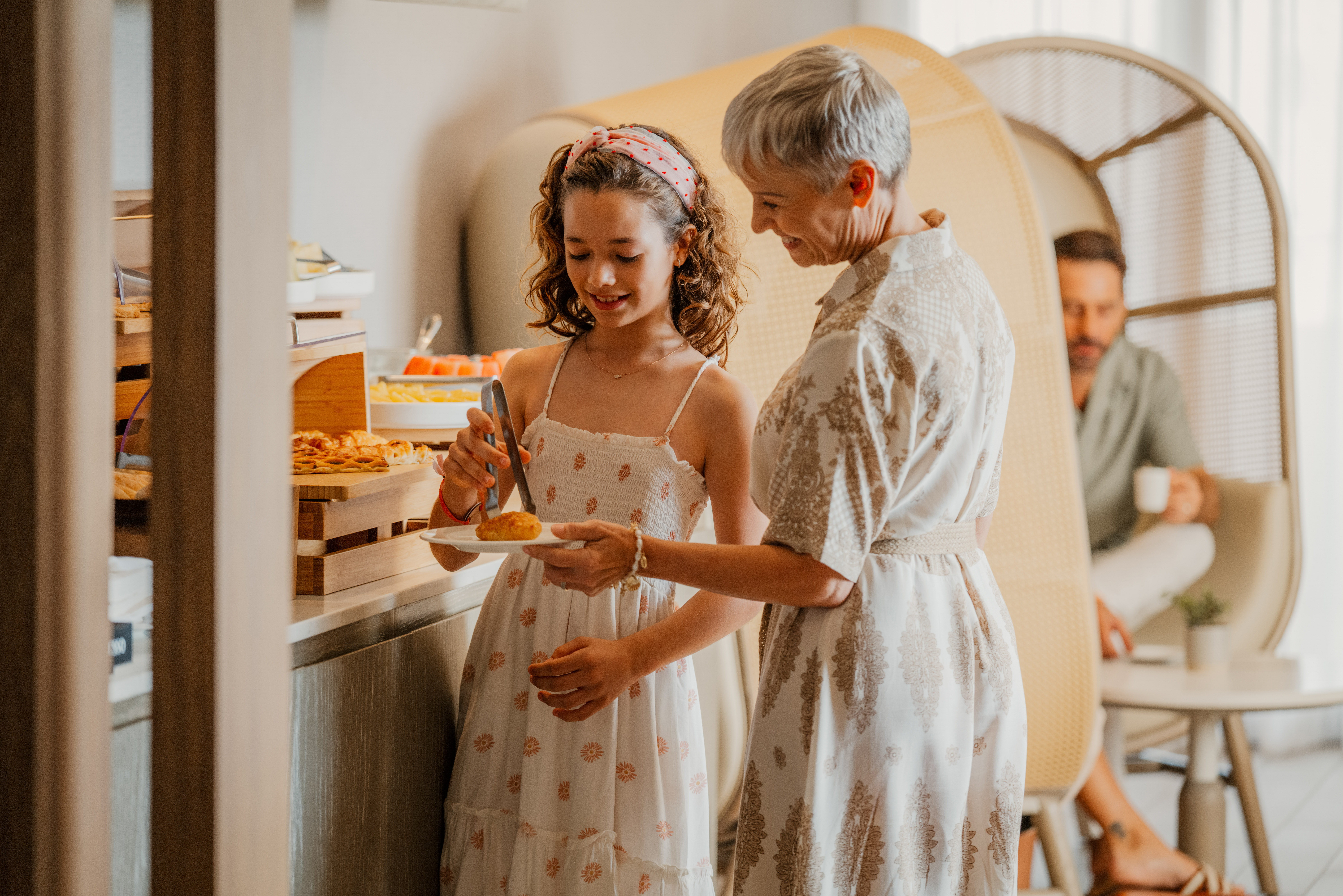 a living room with white couches and a coffee table