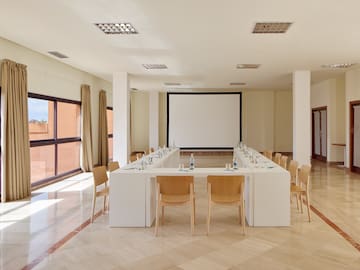 a room with a large table and chairs