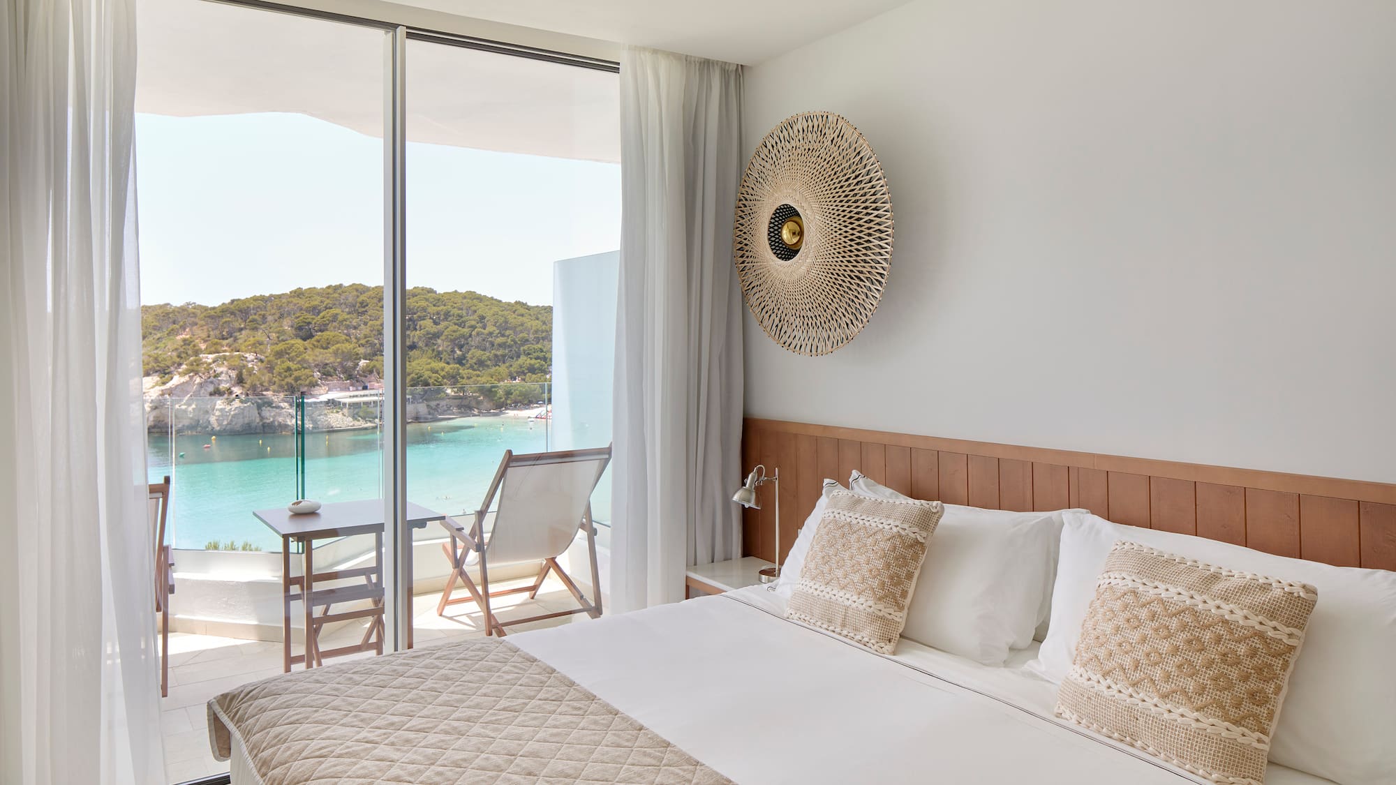 a bed with a view of the ocean