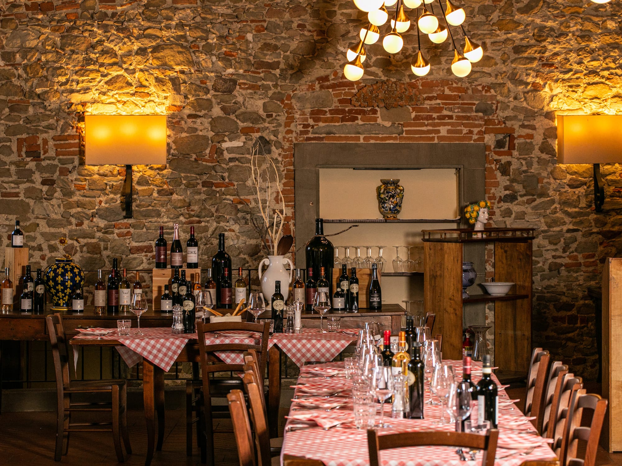a table with wine bottles and glasses on it