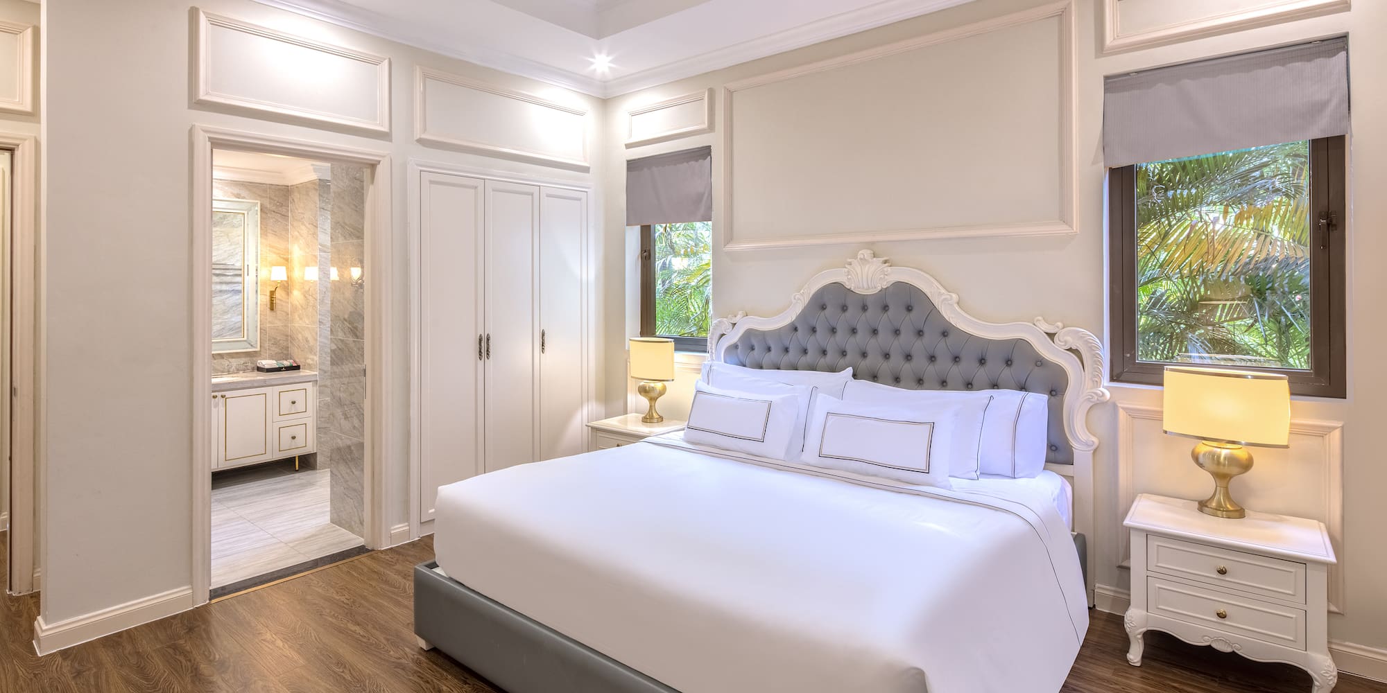 a bedroom with a bed and a walk-in shower