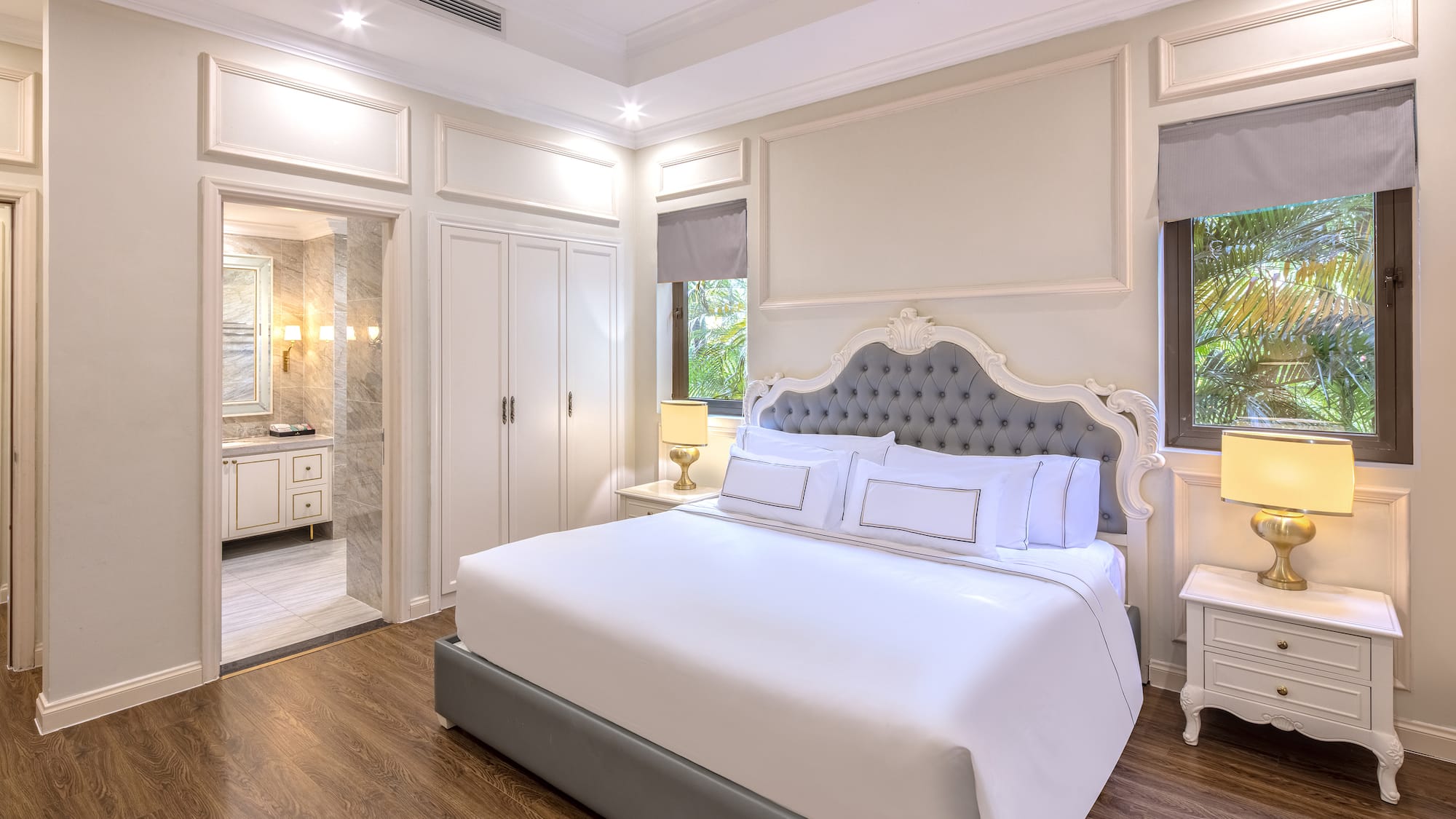 a bedroom with a bed and a walk-in shower