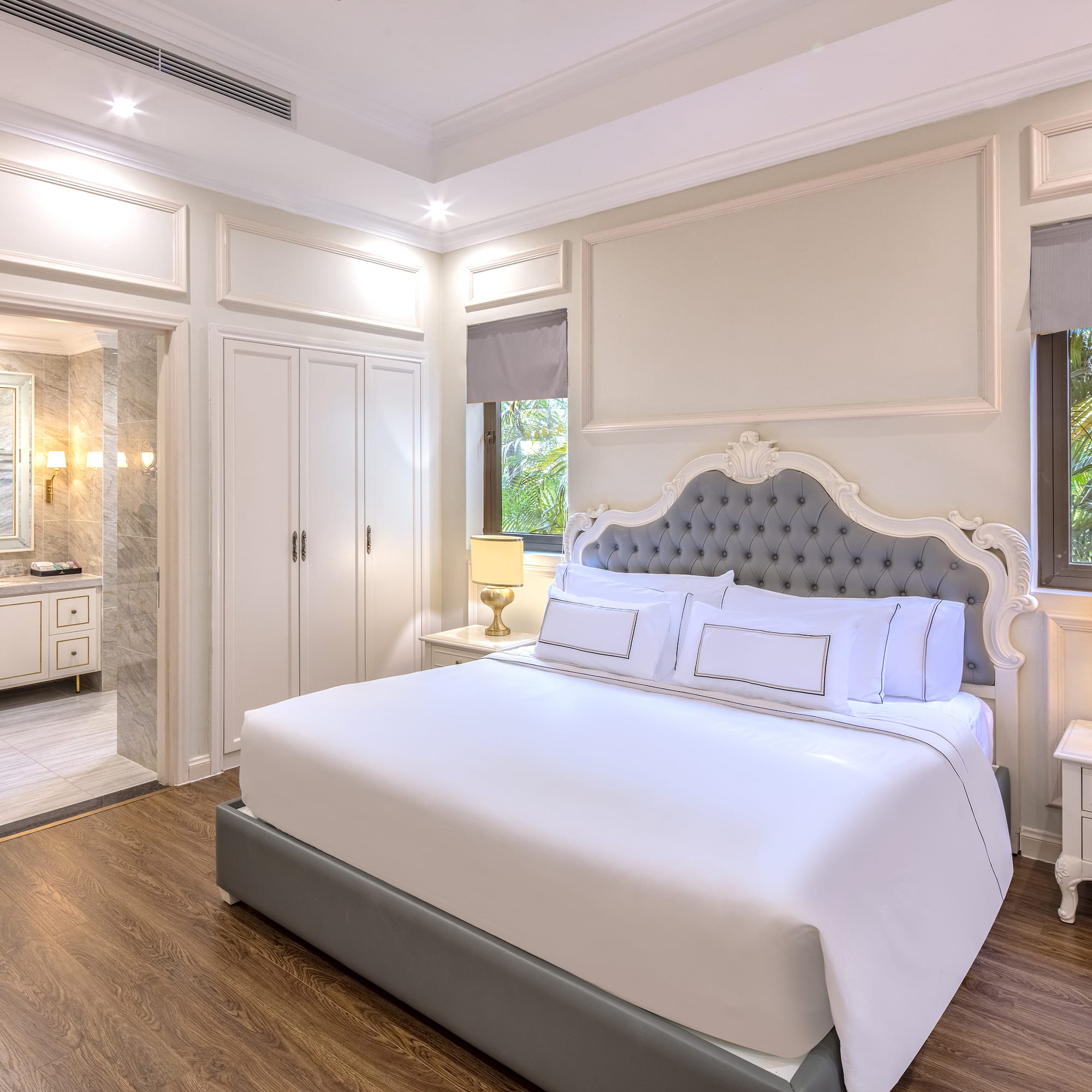 a bedroom with a bed and a walk-in shower