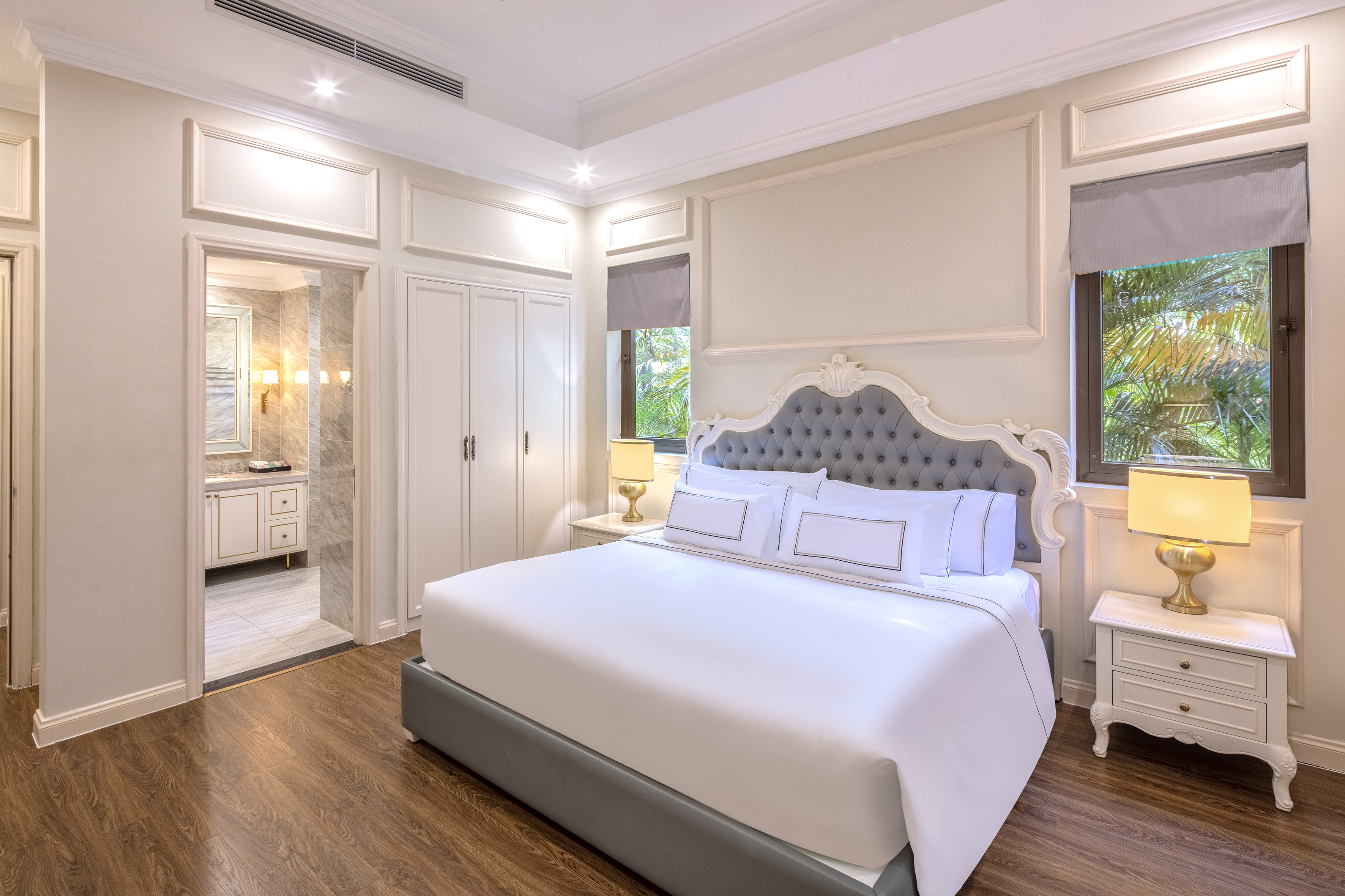 a bedroom with a bed and a walk-in shower