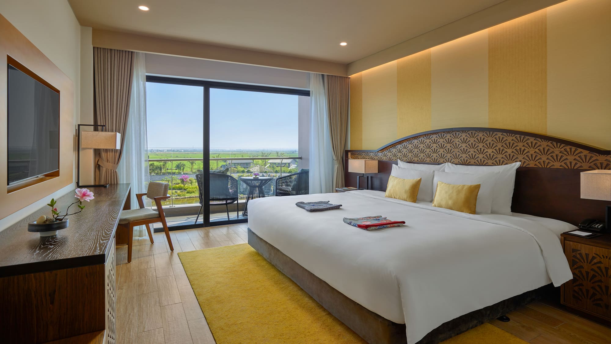 a room with a bed and a glass door