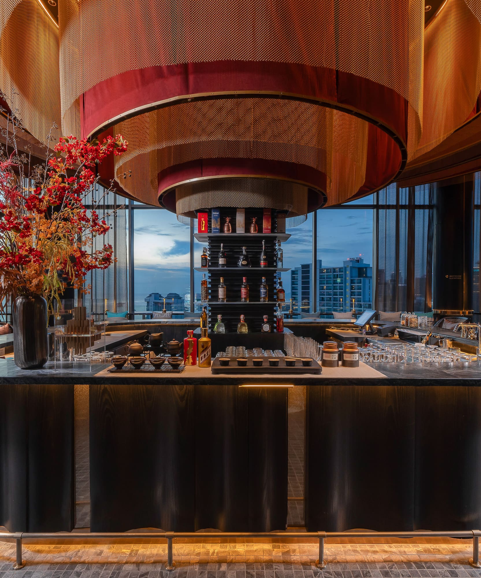 a bar with a flower arrangement in it