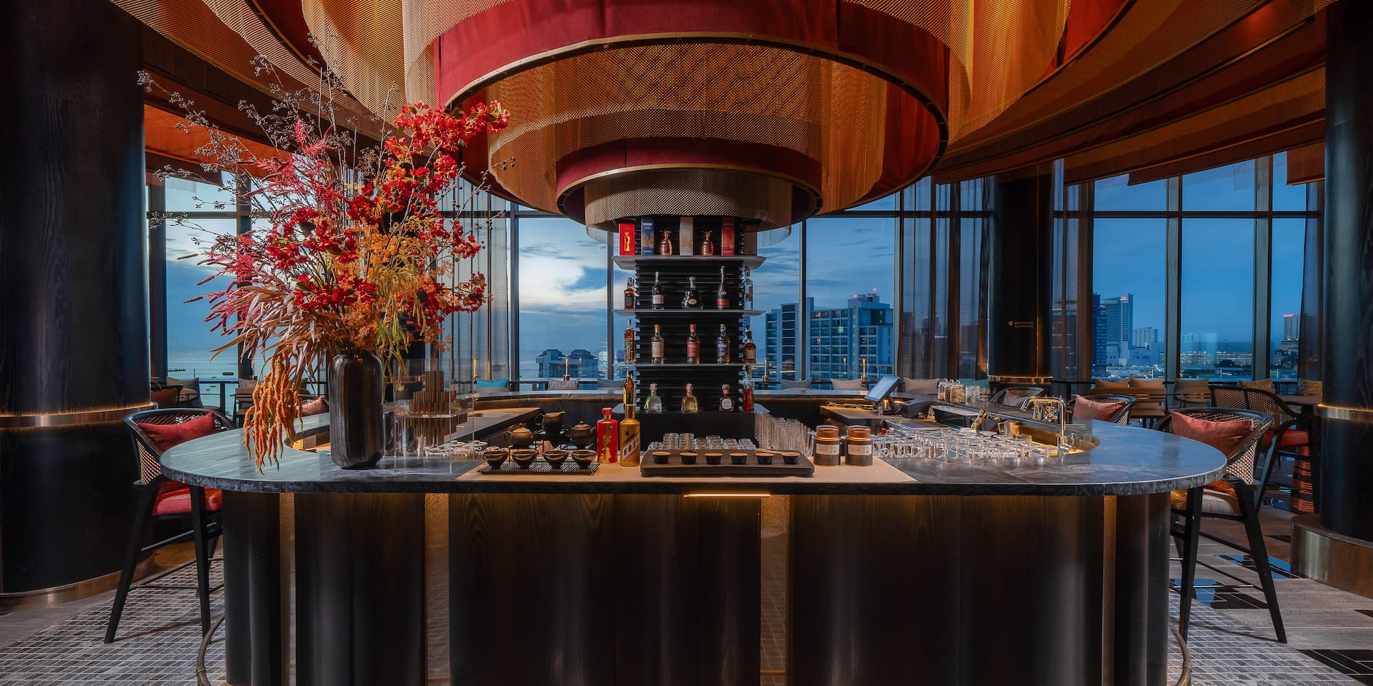 a bar with a flower arrangement in it