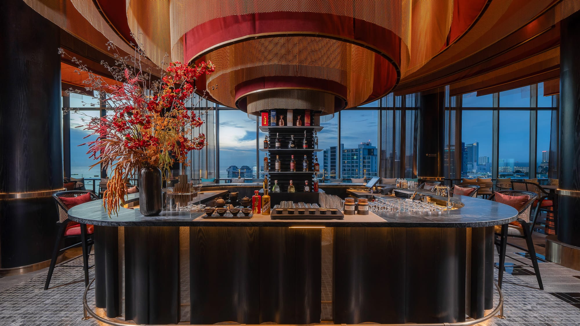 a bar with a flower arrangement in it