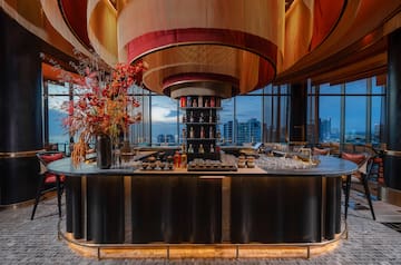 a bar with a flower arrangement in it