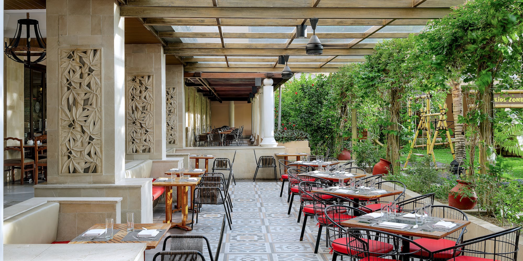 a patio with tables and chairs