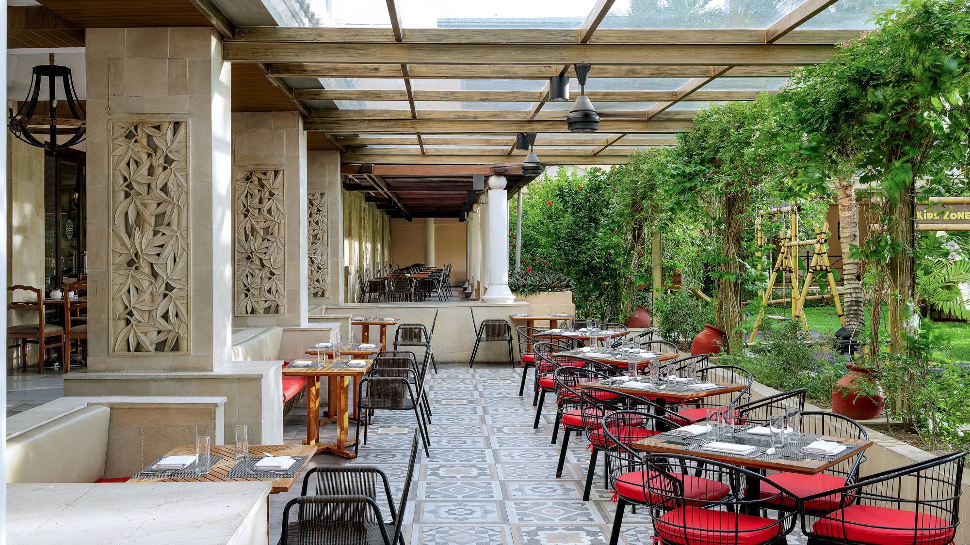a patio with tables and chairs