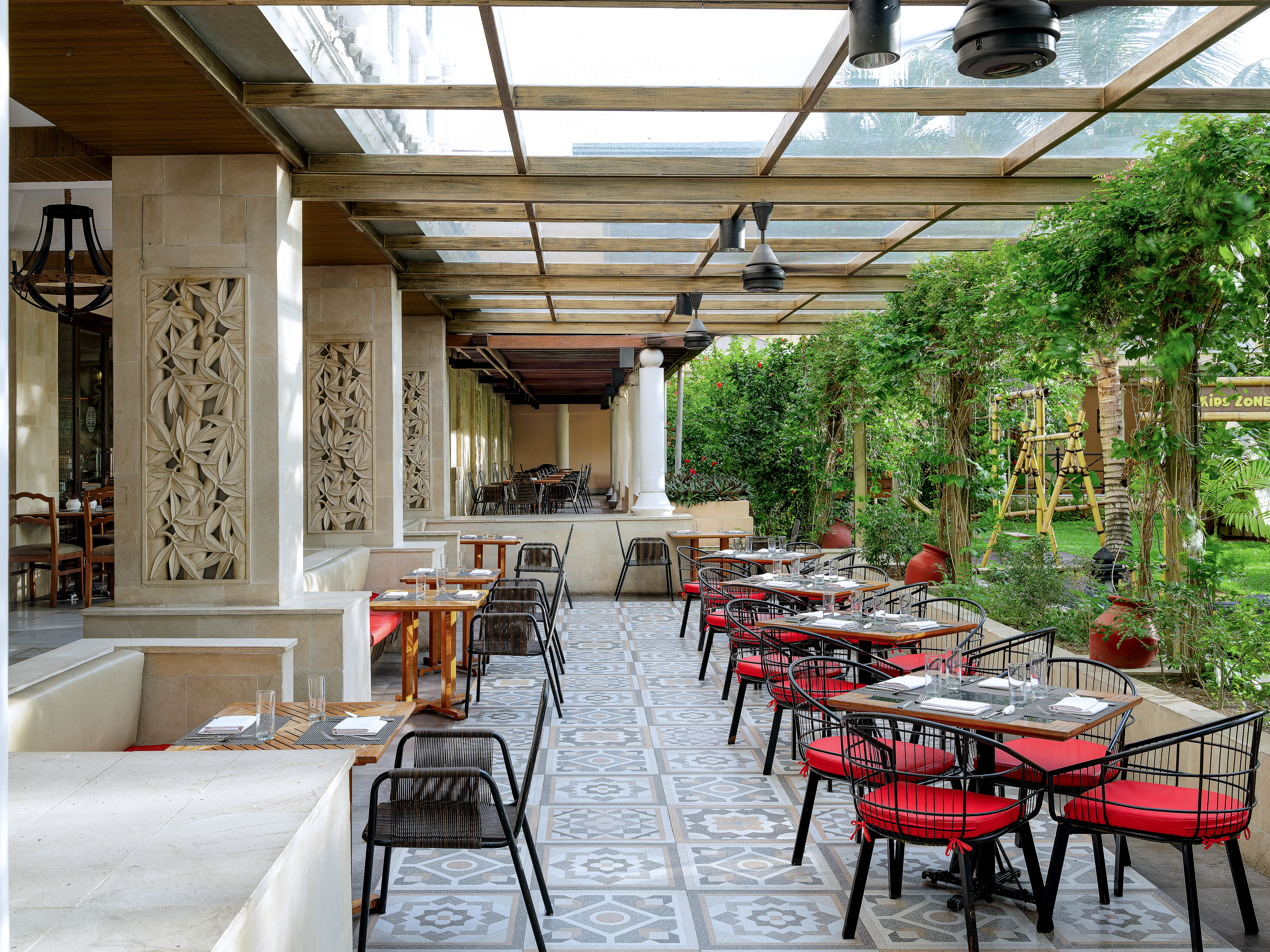 a patio with tables and chairs