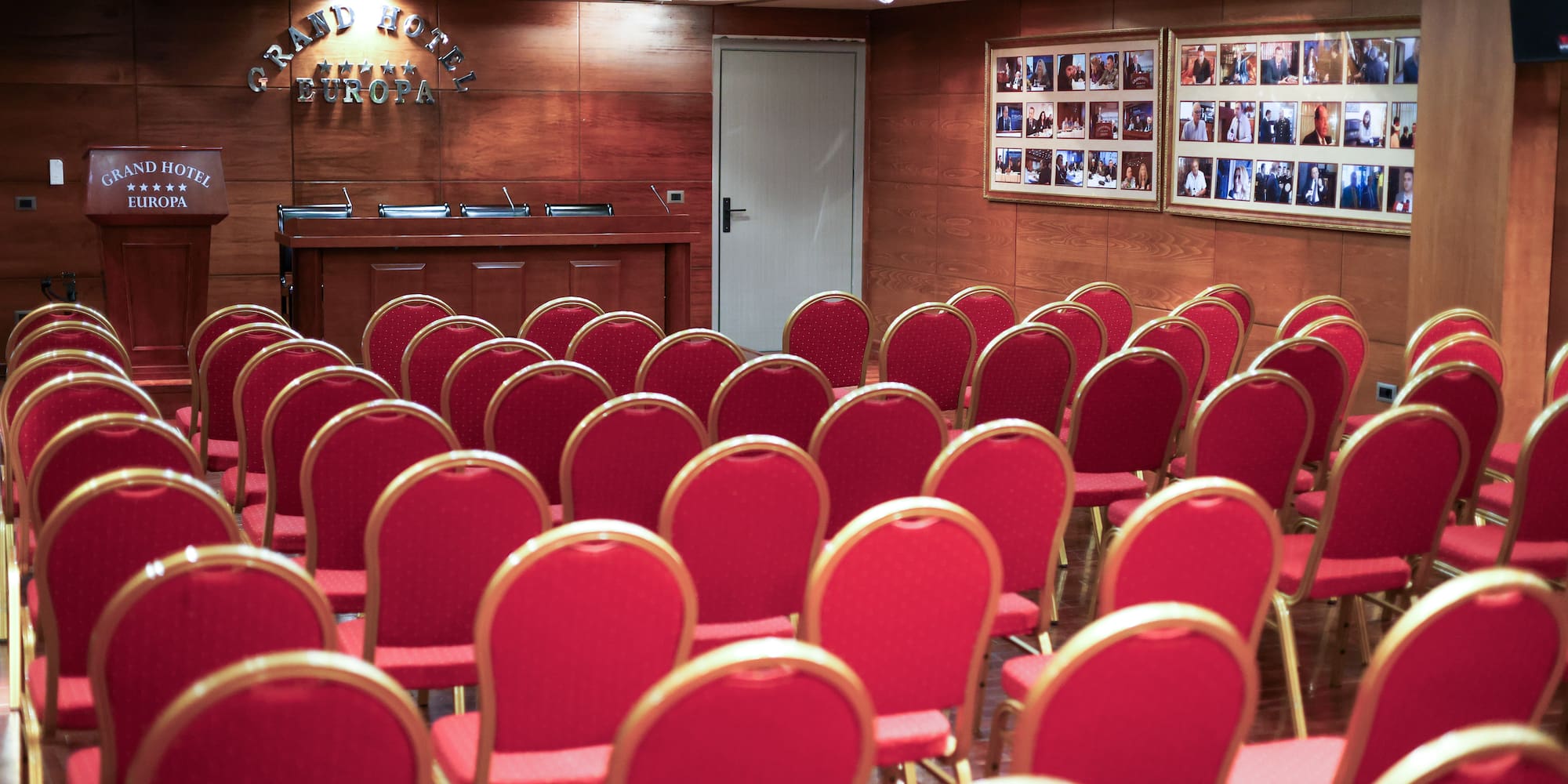 a room with red chairs