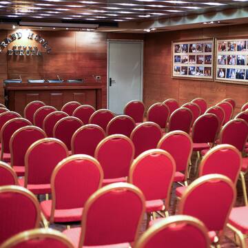 a room with red chairs
