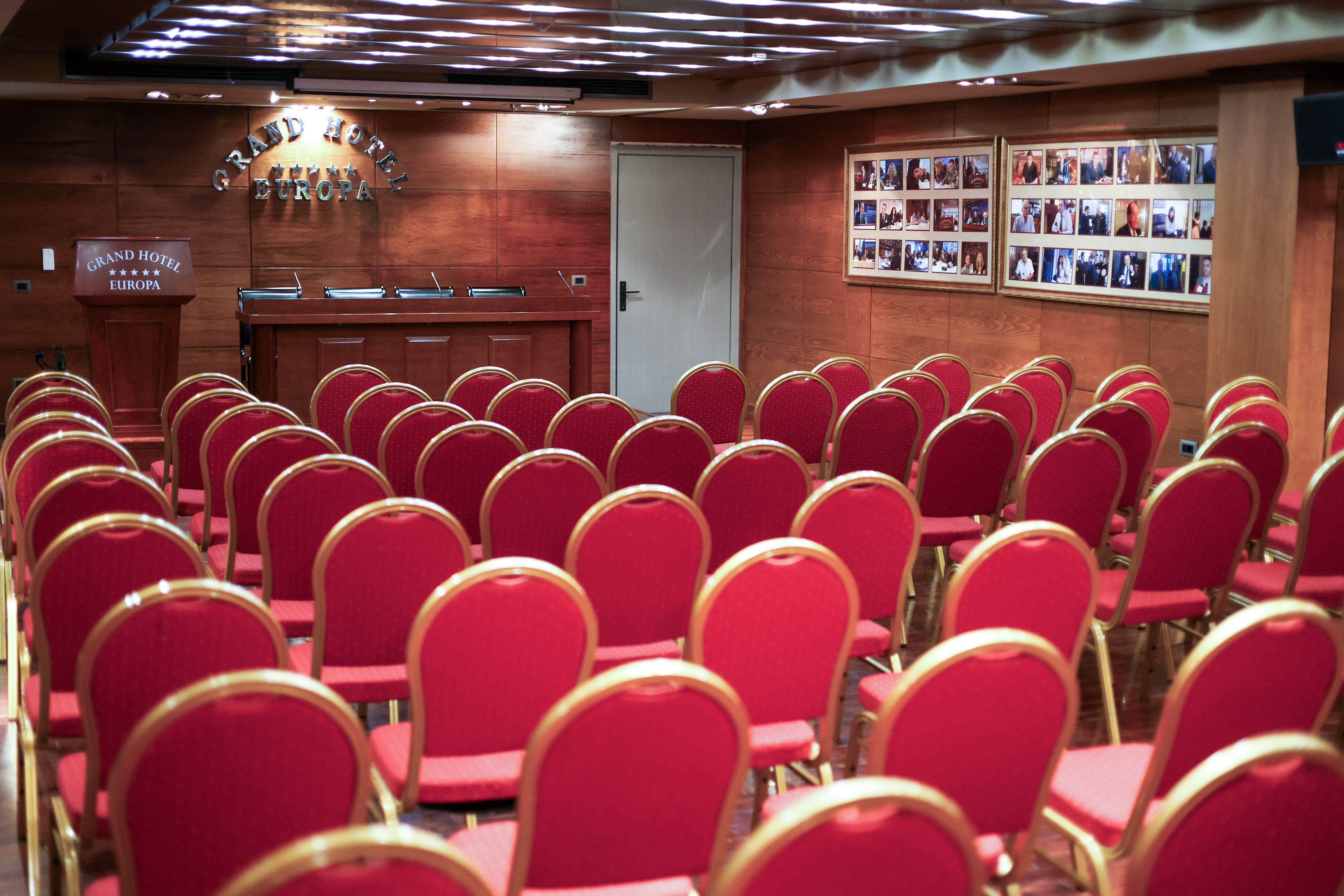 a room with red chairs