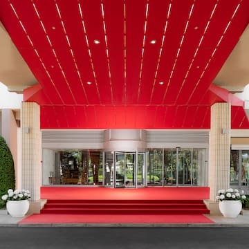 a red carpeted entrance to a building