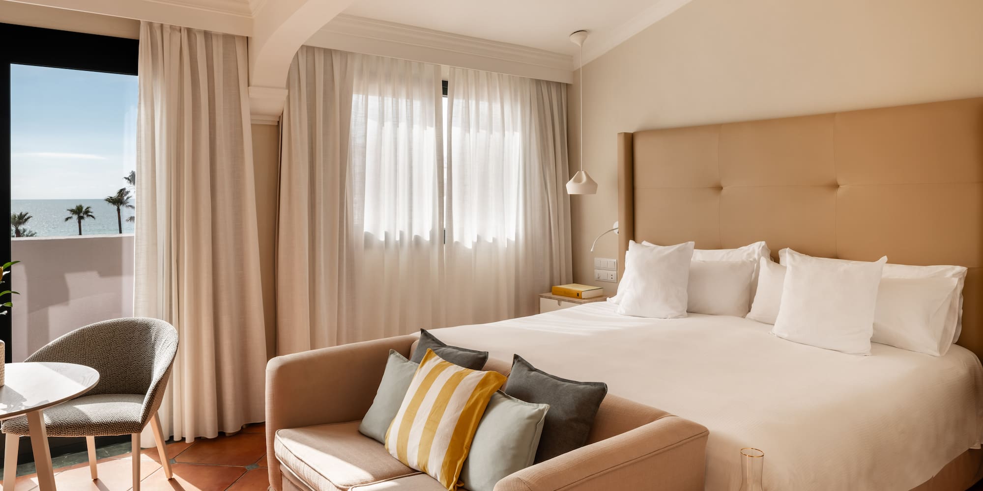 a bed with pillows in a room