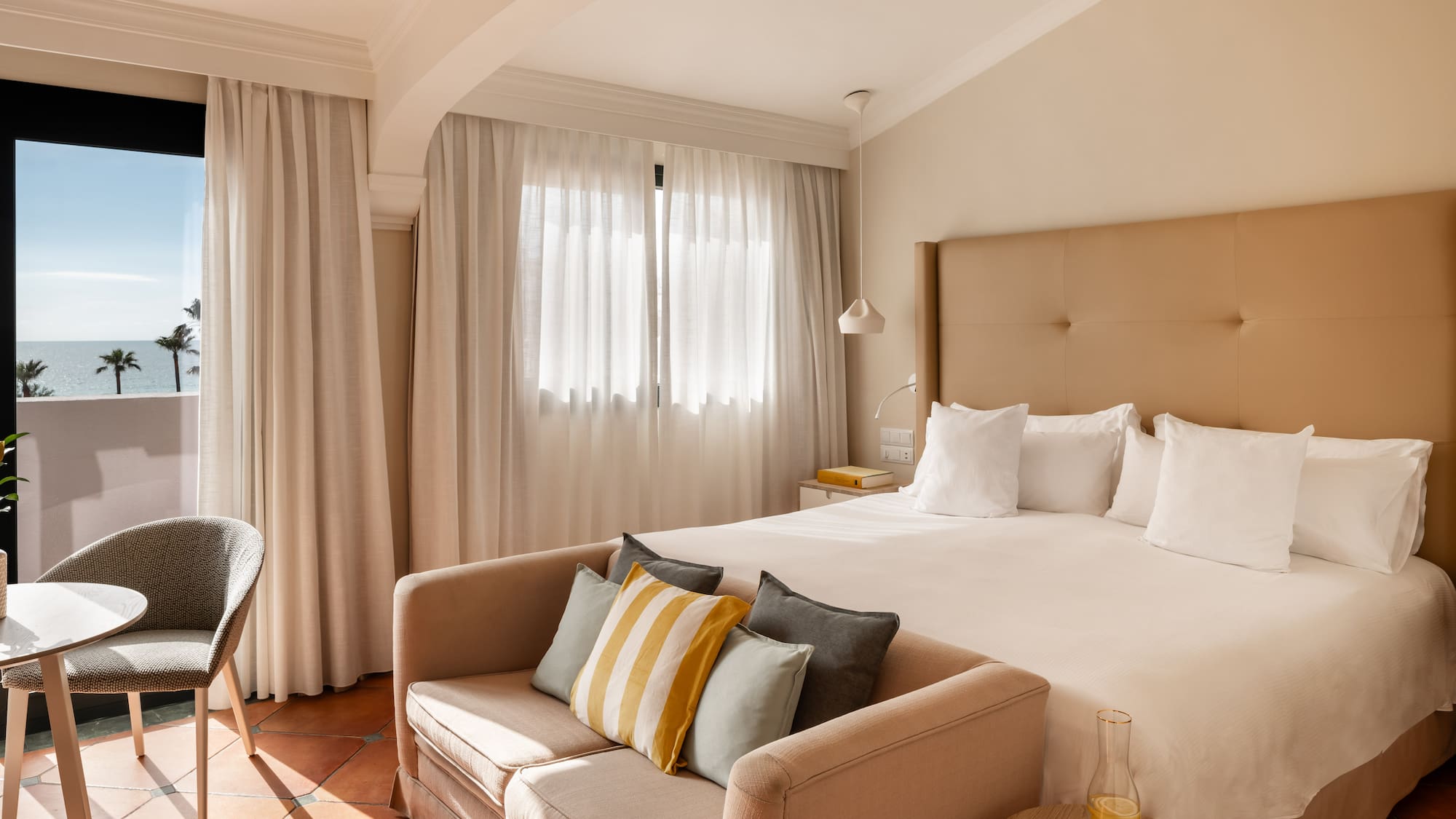 a bed with pillows in a room