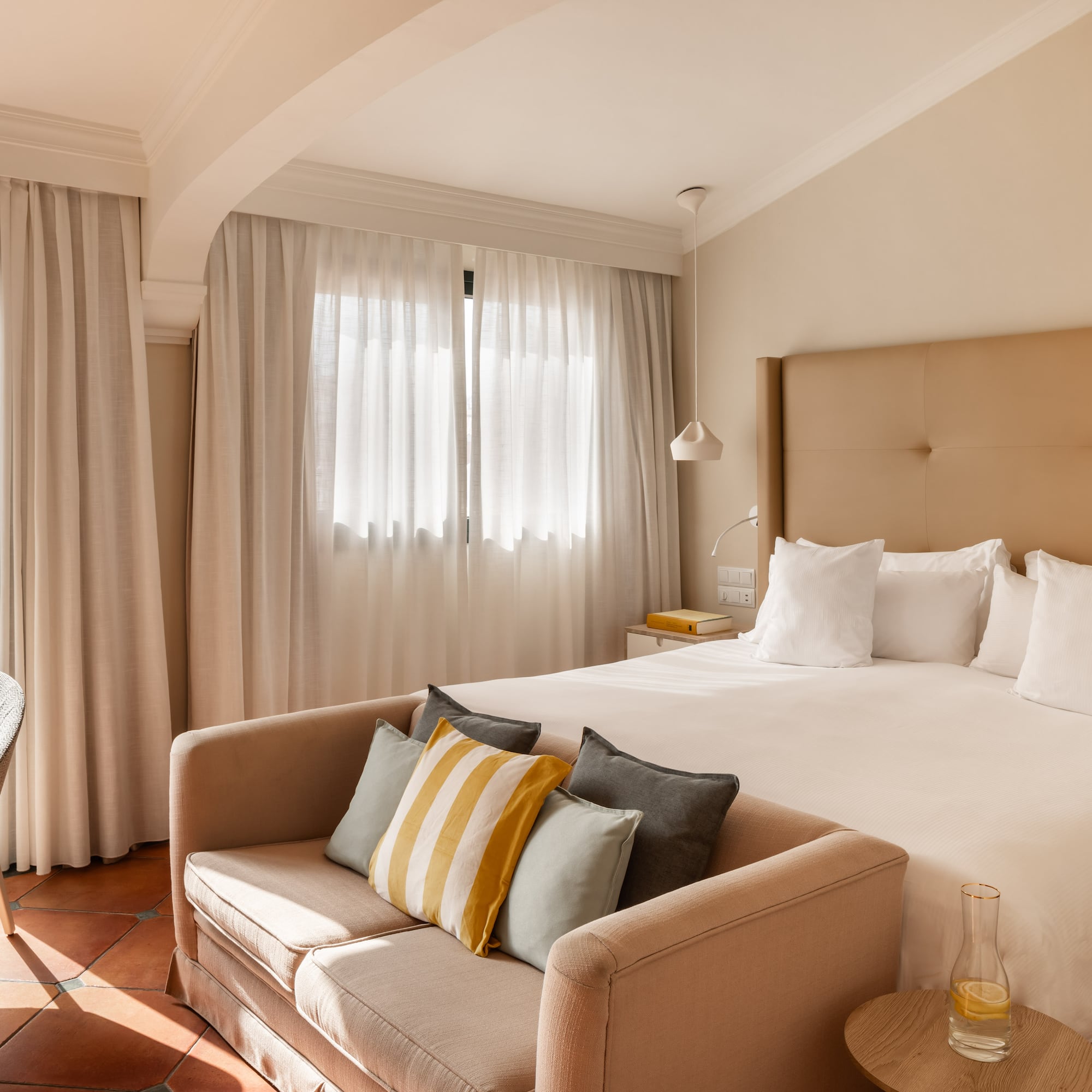 a bed with pillows in a room