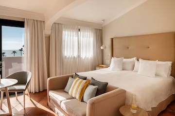 a bed with pillows in a room